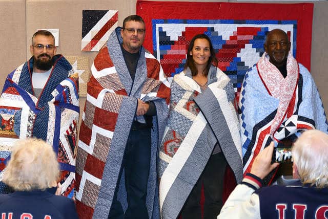 Left to right: MSgt Gregory Friend, Petty Officer 3rd Class Donald J O’Brien, 1st Ltn Jessica Zilm and SMSgt Mark Longus Quilts of Valor Presentation on November 8th